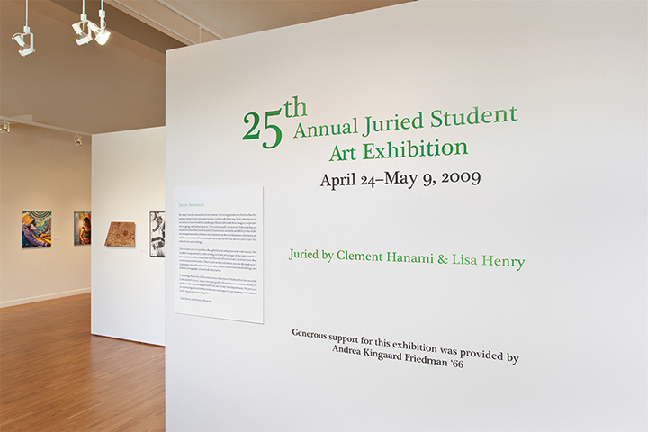 a white wall with green text across it.